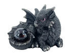 Baby Black Dragon Holding Orb
